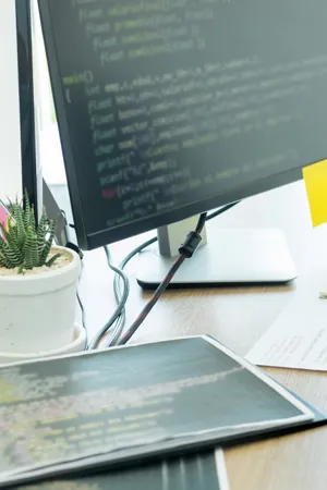 cropped-hands-programmers-coding-computers-office.jpg