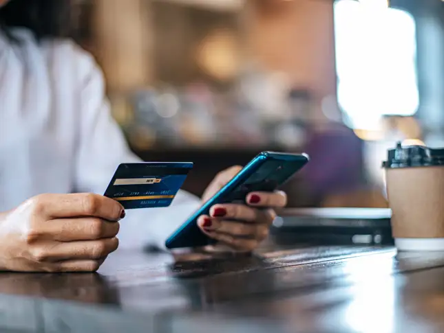 pay-goods-by-credit-card-through-smartphone-coffee-shop.jpg