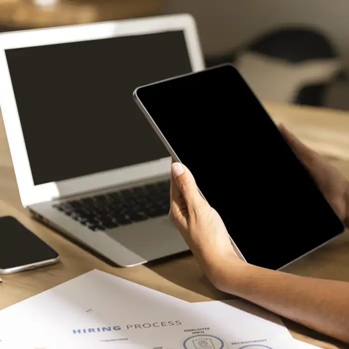 mid-shot-woman-table-looking-tablet.jpg