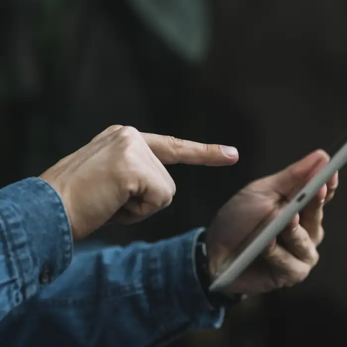 close-up-man-pointing-finger-digital-tablet.jpg